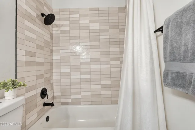 a front view of a house with patio and yard