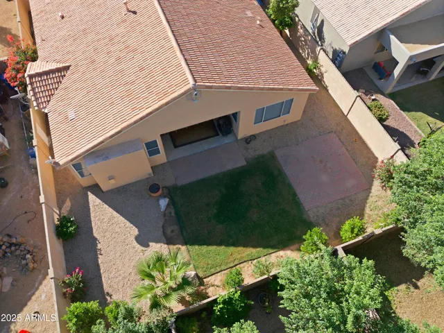an aerial view of residential houses with outdoor space