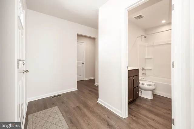 a bathroom with a sink a toilet and a bathtub