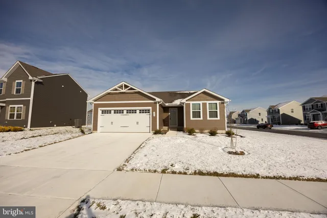 a view of front of house with a yard