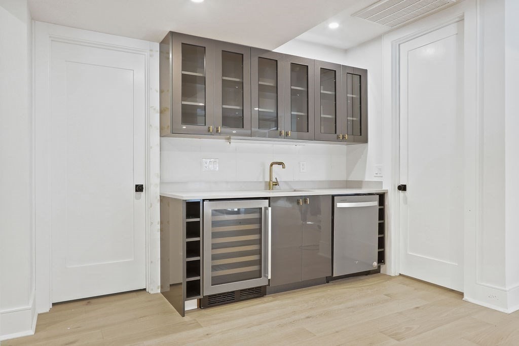 216 Greendale Avenue Needham, MA 02494 - Photo 31 of 40 a view of an entryway with wooden cabinet