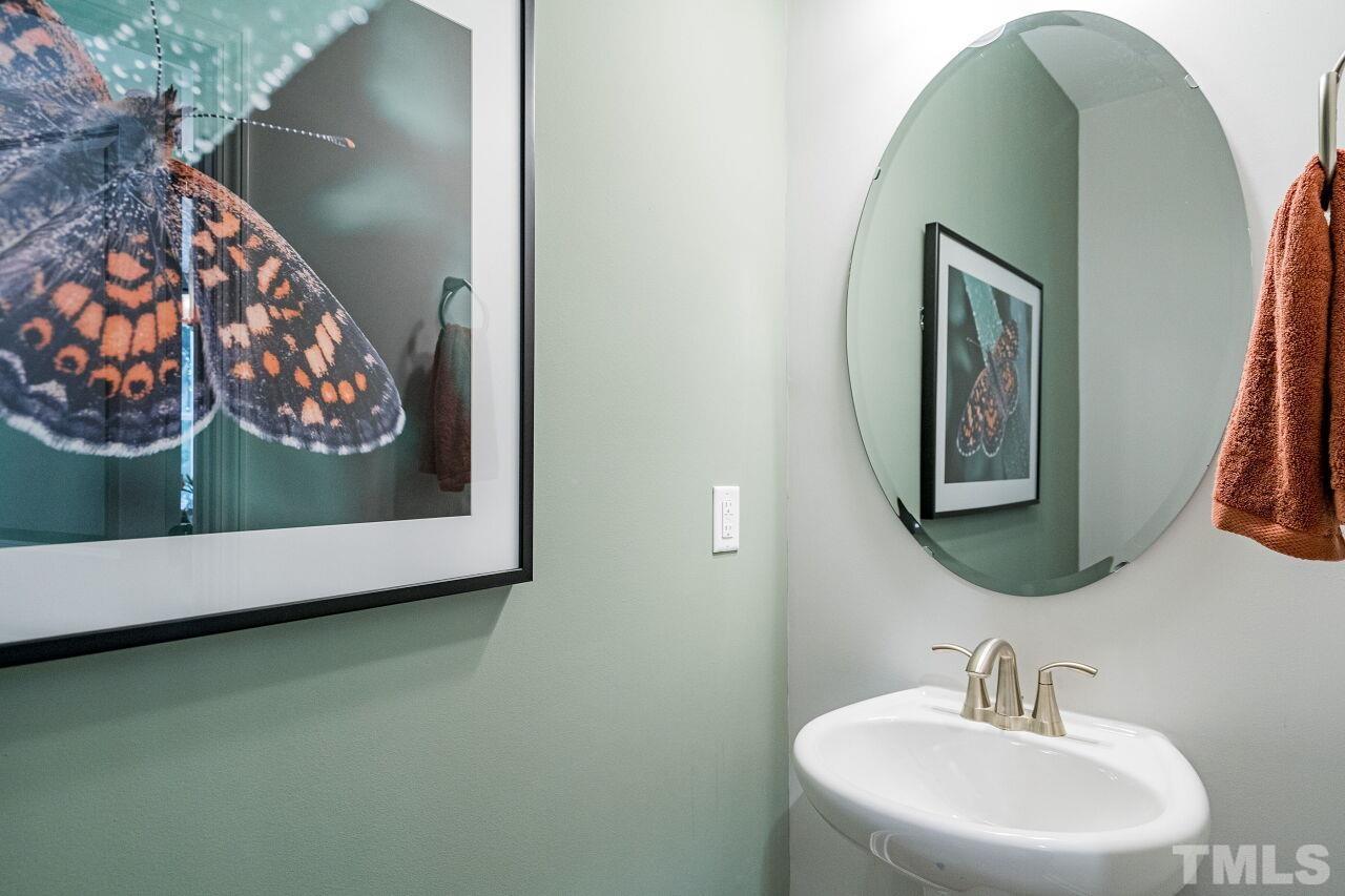 3107 Dunnock Drive, Unit 6 Durham, NC 27713 - Photo 14 of 27 a bathroom with a sink and mirror