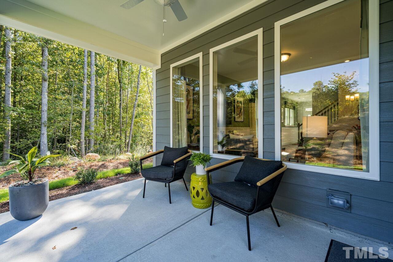 3107 Dunnock Drive, Unit 6 Durham, NC 27713 - Photo 27 of 27 a living room filled with furniture and a potted plant