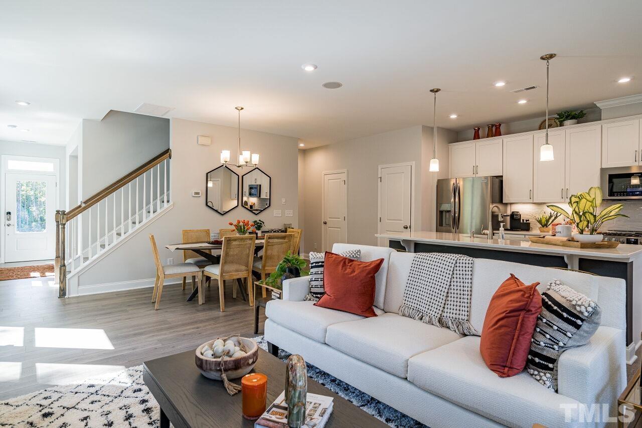 3107 Dunnock Drive, Unit 6 Durham, NC 27713 - Photo 5 of 27 a living room with furniture kitchen view and a dining table