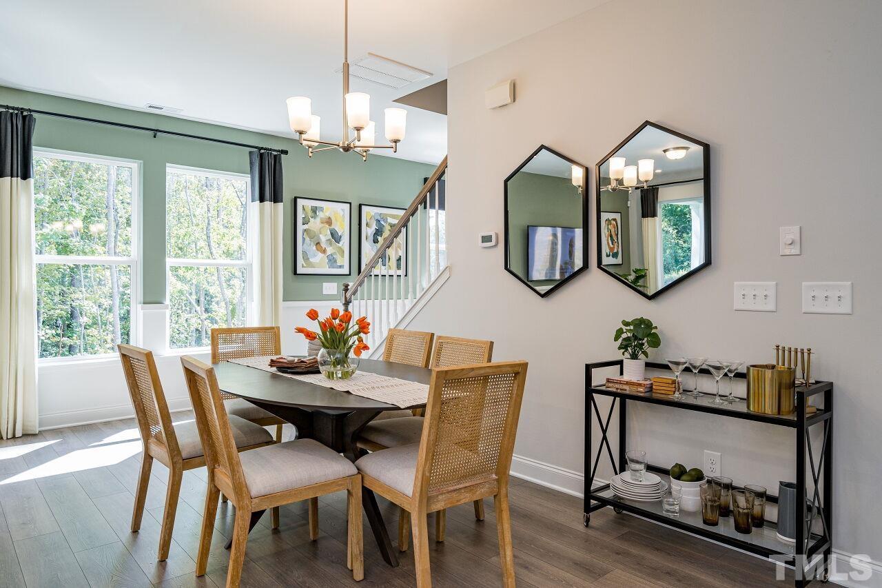 3107 Dunnock Drive, Unit 6 Durham, NC 27713 - Photo 8 of 27 a view of a dining room with furniture window and wooden floor