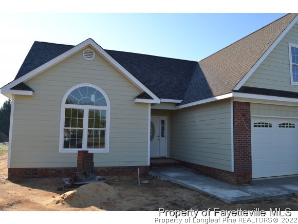 9628 Lukes Run Road Linden, NC 28356 - Photo 2 of 25 a front view of a house with a yard