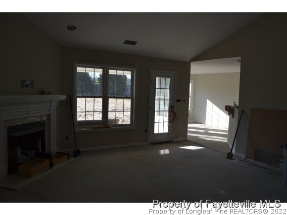 9628 Lukes Run Road Linden, NC 28356 - Photo 6 of 25 a living room with furniture and a fireplace