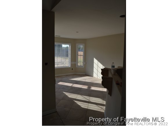 9628 Lukes Run Road Linden, NC 28356 - Photo 9 of 25 a view of a living room with a chair and frames on the wall