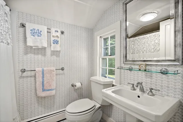 a living room with furniture a large window