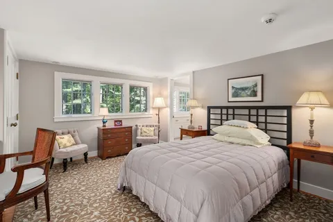 a view of a house with backyard sitting area and garden