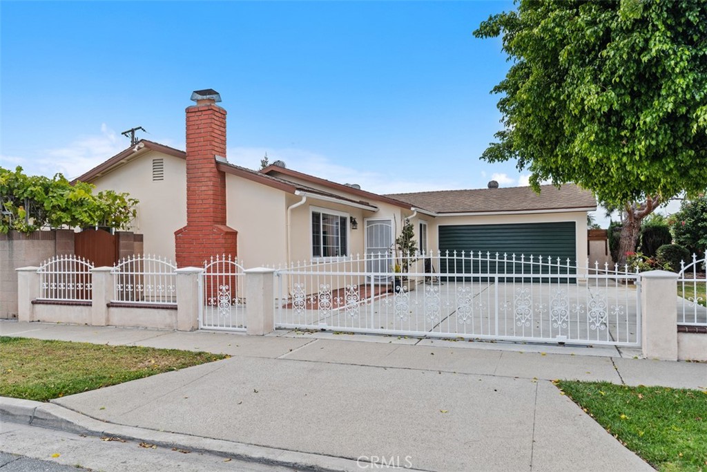 8792 Belday Street Cypress, CA 90630 - Photo 3 of 38 front view of a house with a street