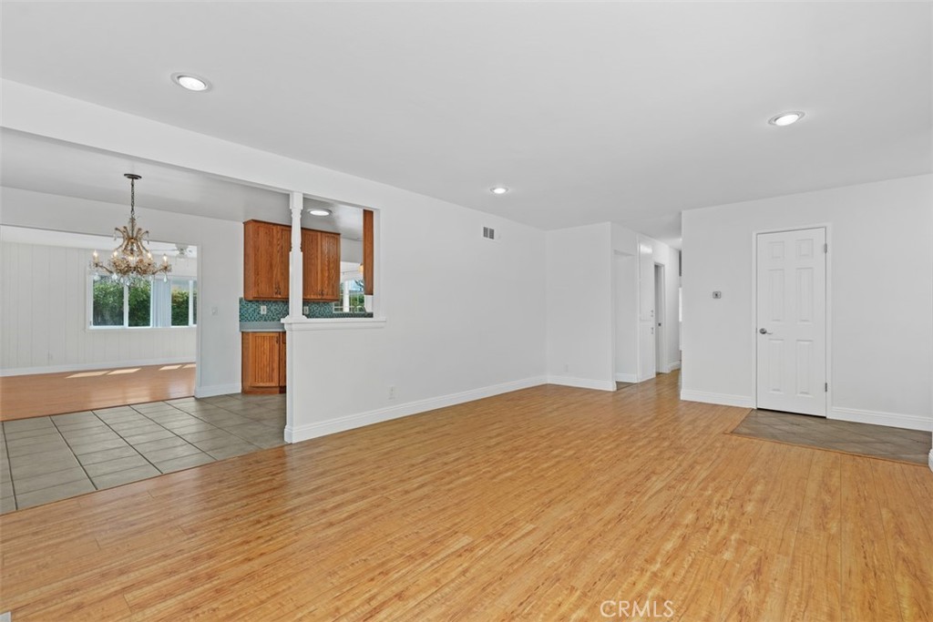 8792 Belday Street Cypress, CA 90630 - Photo 8 of 38 a view of empty room with wooden floor and windows