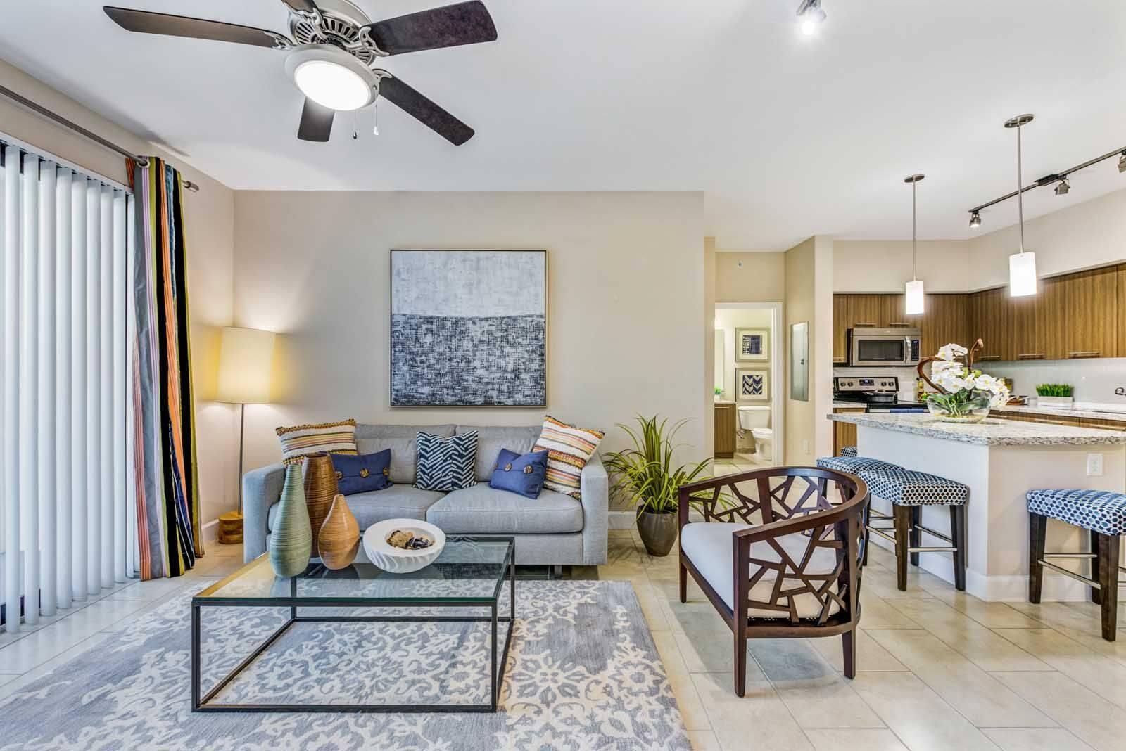 16812 Southwest 137th Avenue, Unit 833 Miami, FL 33177 - Photo 5 of 14 a living room with furniture and kitchen view