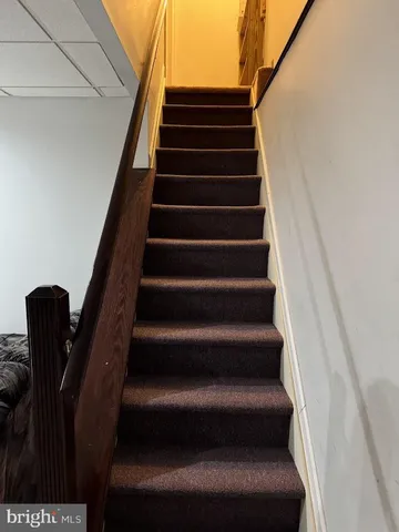 a room with furniture and a ceiling fan