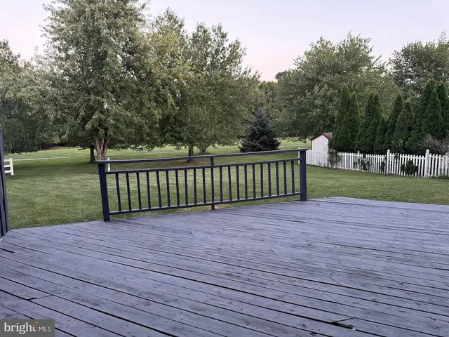 a view of a deck with a yard