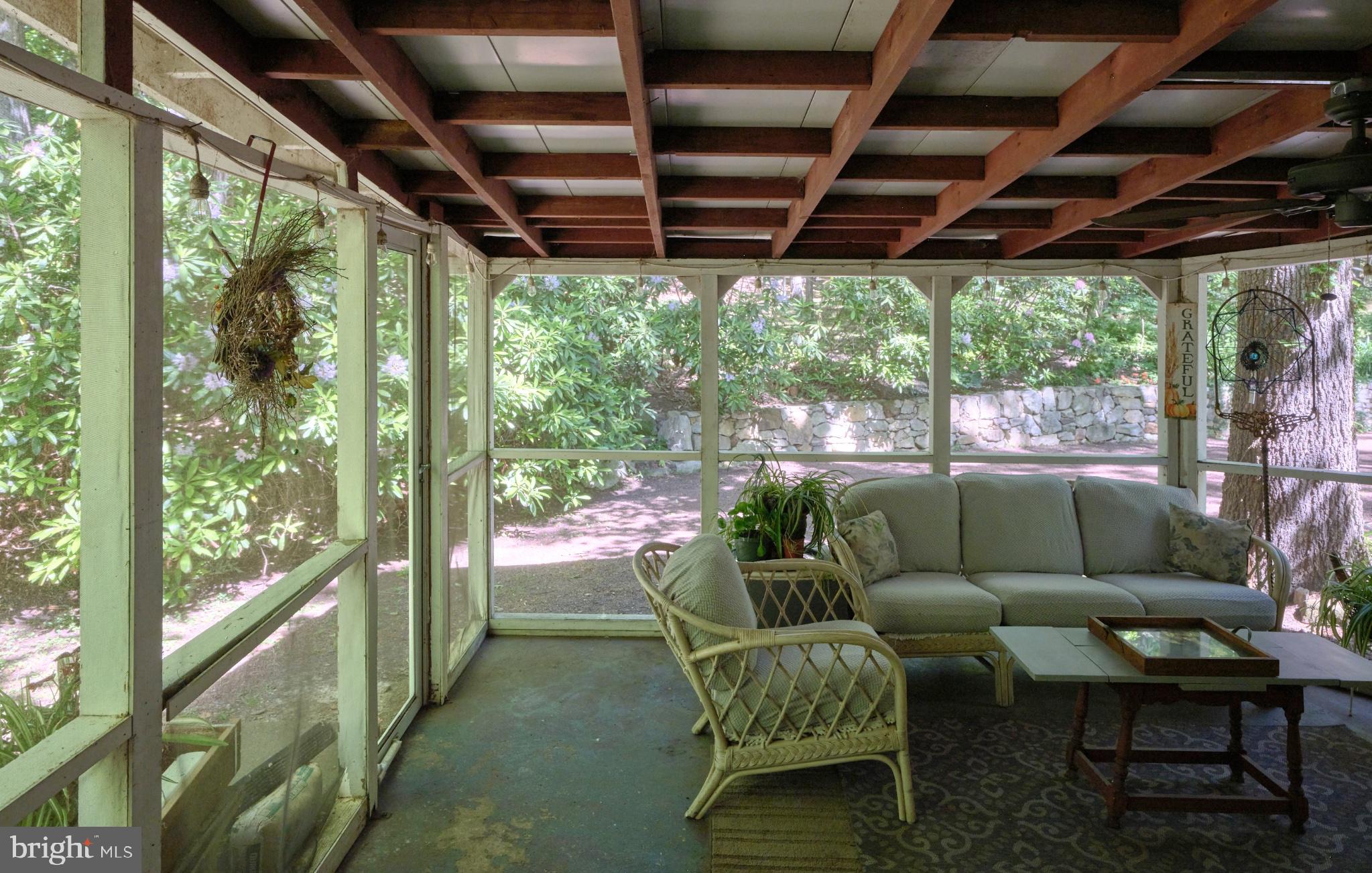 4831 Mountain Top Road West, Unit W New Hope, PA 18938 - Photo 4 of 28 Serene sunlit retreat with nature views.