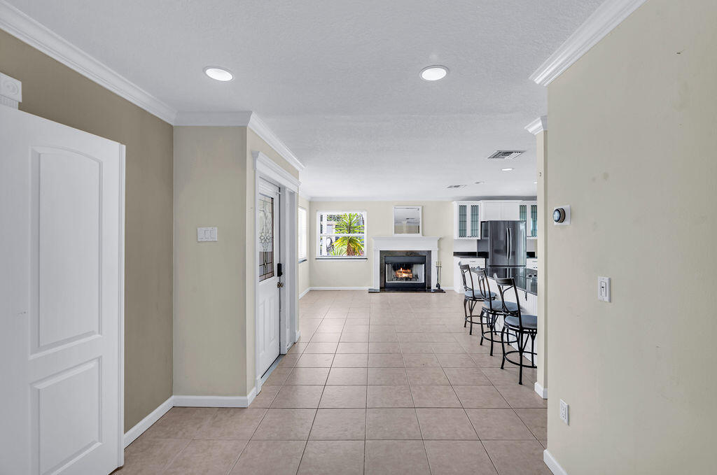 614 Southeast Flamingo Avenue Stuart, FL 34996 - Photo 20 of 49 a view of livingroom with furniture and fireplace
