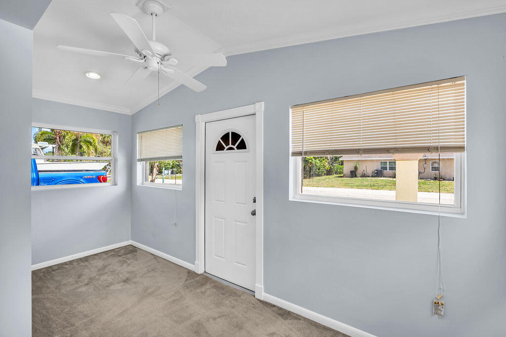 614 Southeast Flamingo Avenue Stuart, FL 34996 - Photo 28 of 49 wooden floor in an empty room with a window