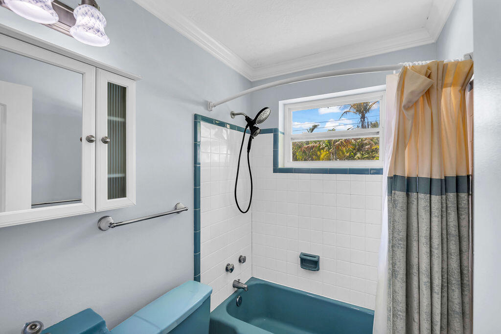 614 Southeast Flamingo Avenue Stuart, FL 34996 - Photo 33 of 49 a bathroom with a granite countertop shower and a sink