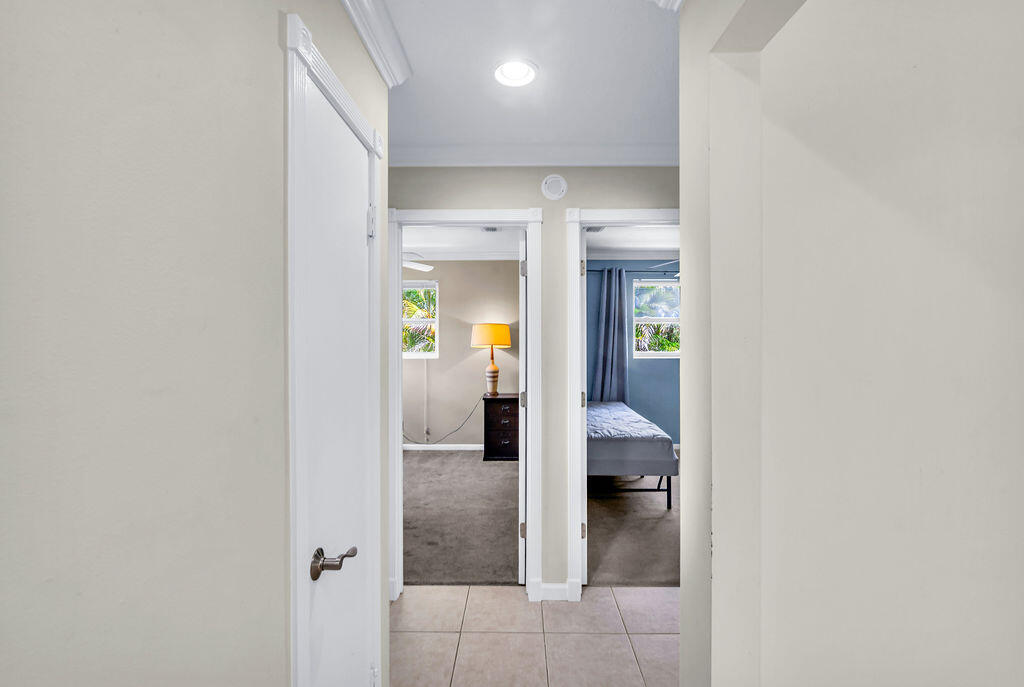 614 Southeast Flamingo Avenue Stuart, FL 34996 - Photo 37 of 49 hallway with wooden floor