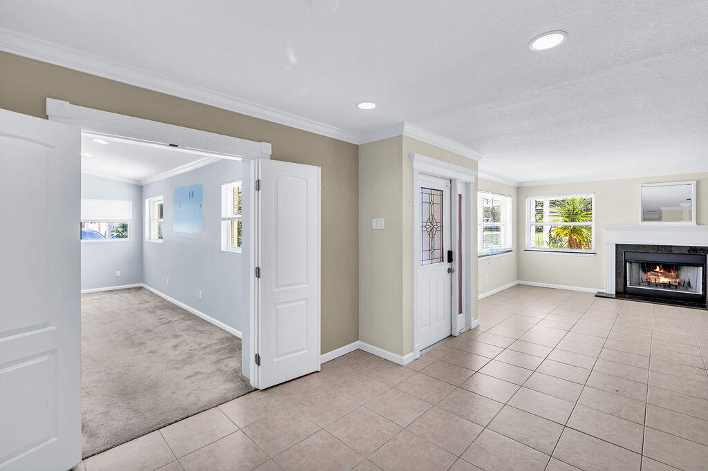 614 Southeast Flamingo Avenue Stuart, FL 34996 - Photo 38 of 49 a view of livingroom with hardwood floor and a kitchen