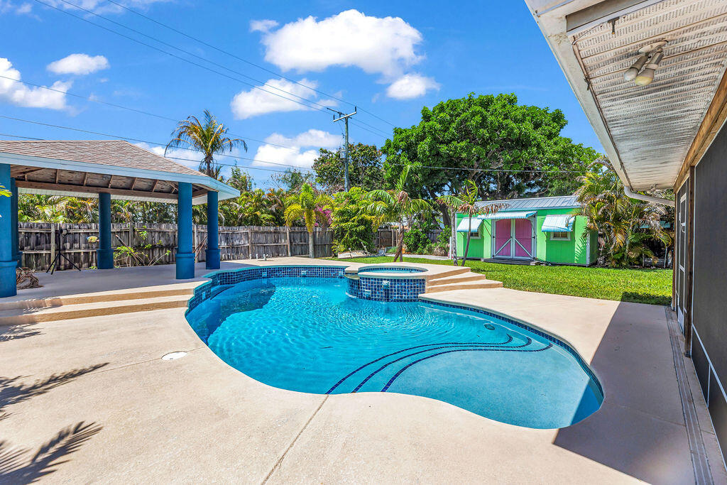 614 Southeast Flamingo Avenue Stuart, FL 34996 - Photo 43 of 49 a view of a swimming pool with a patio