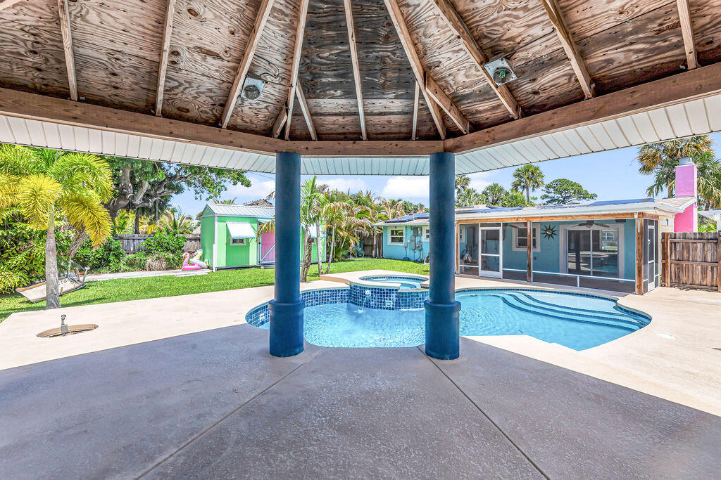 614 Southeast Flamingo Avenue Stuart, FL 34996 - Photo 44 of 49 a house with swimming pool in front of it