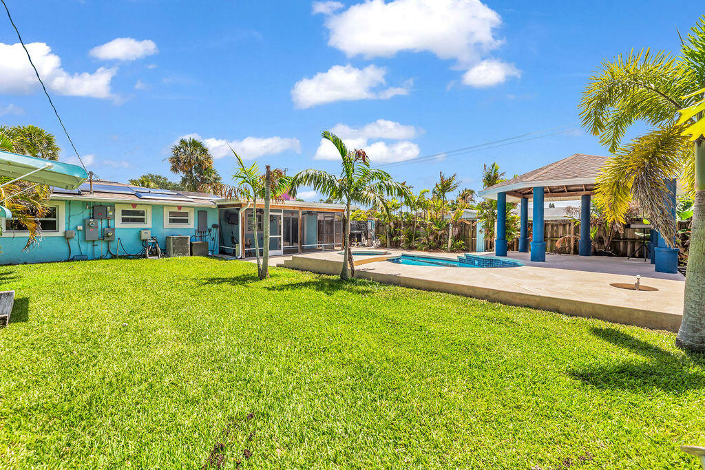 614 Southeast Flamingo Avenue Stuart, FL 34996 - Photo 46 of 49 a view of a house with a swimming pool