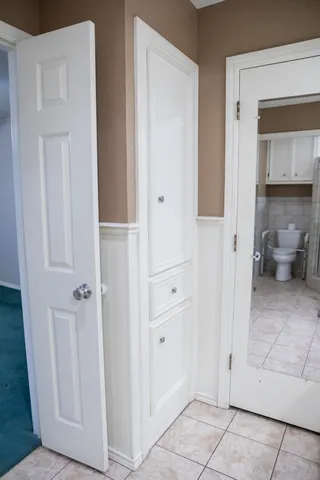 a view of a bathroom from a hallway