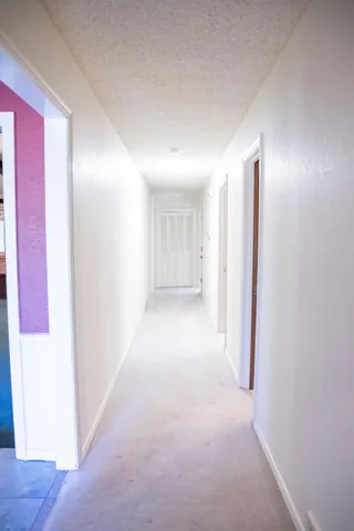 a view of a hallway with closet area