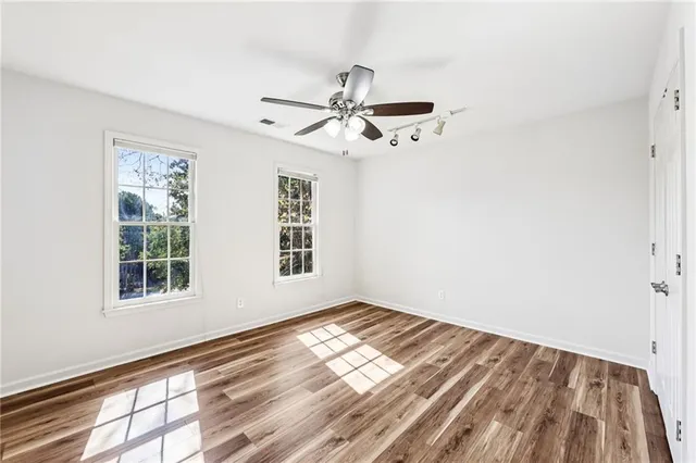 a view of empty room with windows