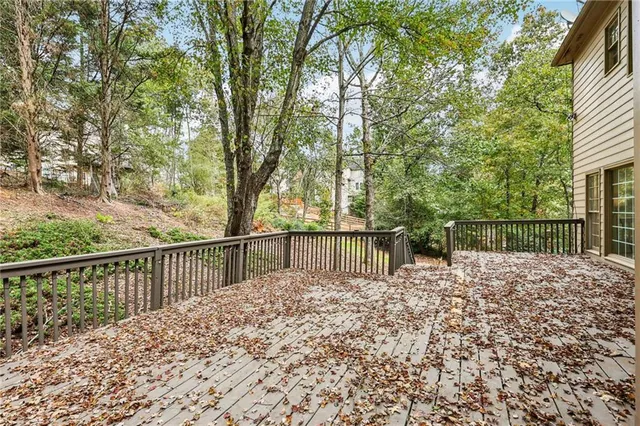 a balcony with trees in front of it