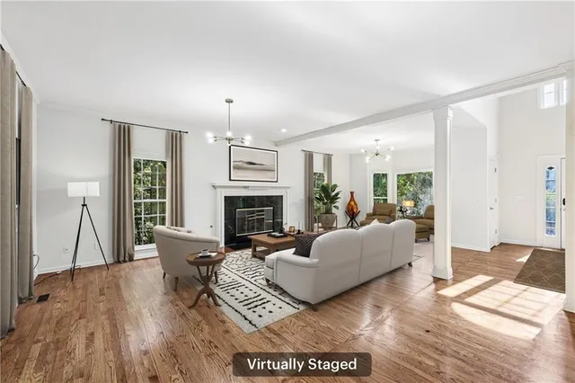 a living room with furniture and a fireplace