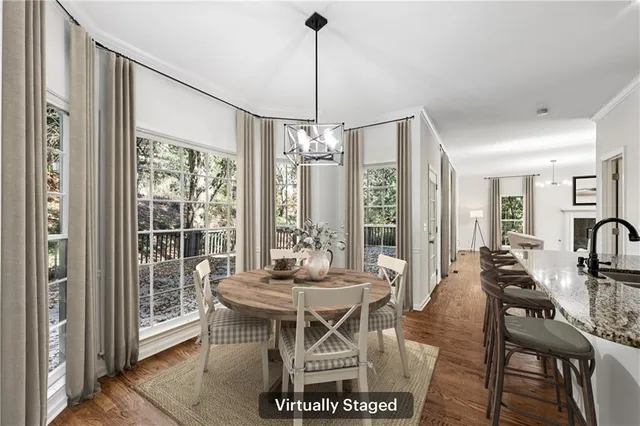 a view of a dining room with furniture window and outside view