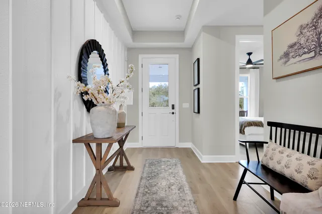 a living room with furniture and painting on the wall