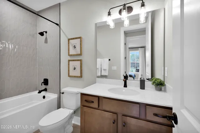 a view of a a dining room with furniture window and wooden floor