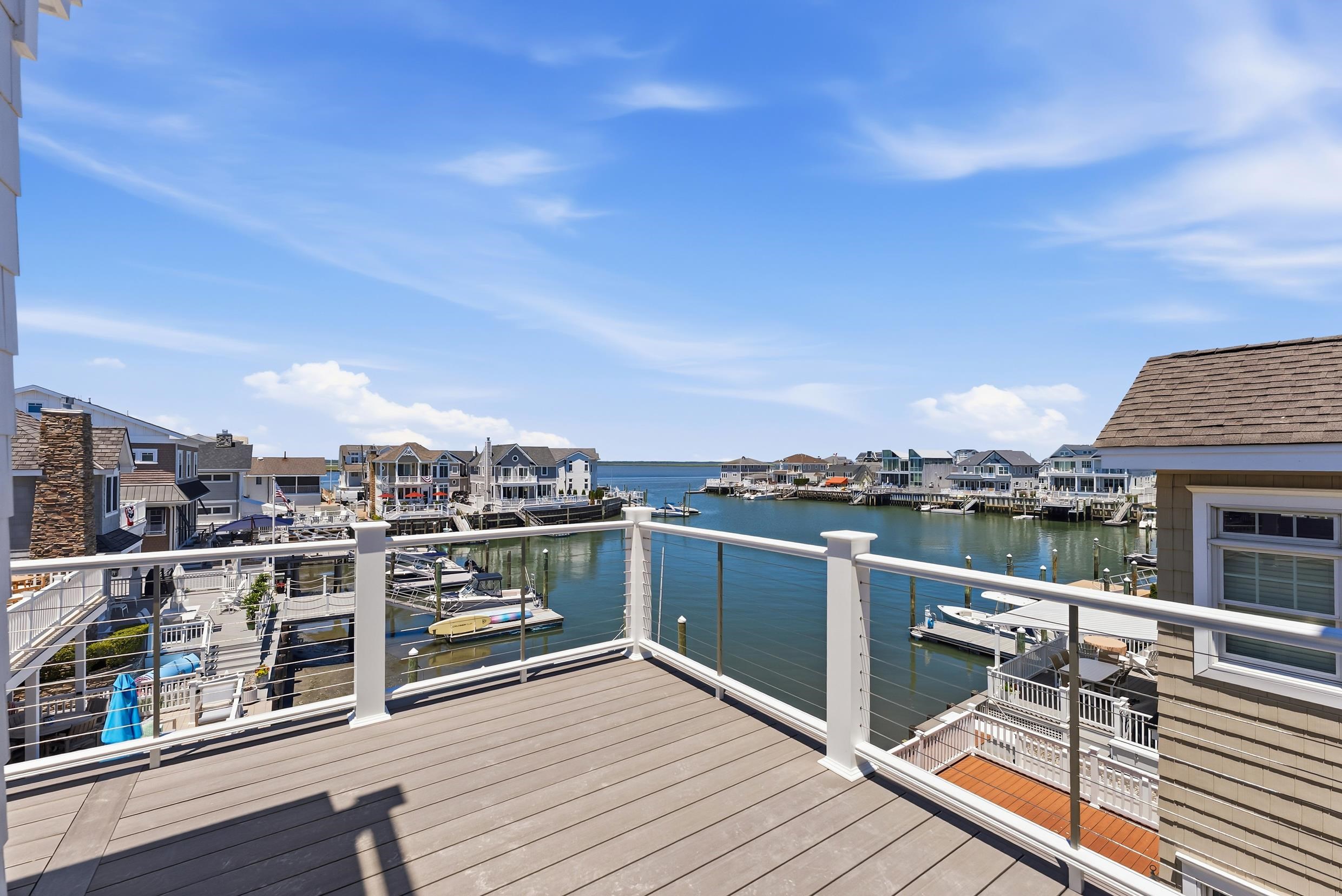 8527 3rd Stone Harbor, NJ 08247 - Photo 24 of 28 a view of a balcony with wooden floor and city view