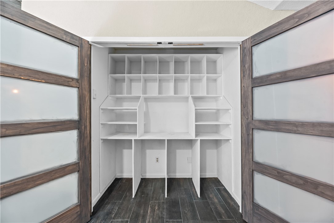 5213 Inverness Drive Corpus Christi, TX 78413 - Photo 16 of 23 a view of a room with wooden floor and cabinet