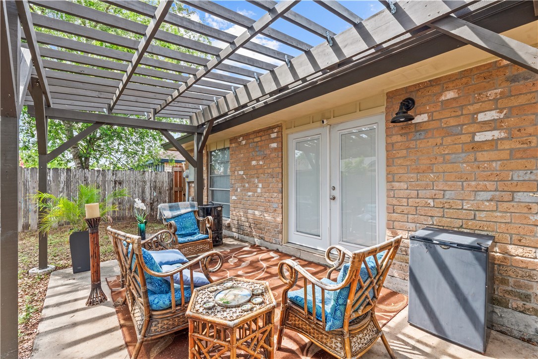 5213 Inverness Drive Corpus Christi, TX 78413 - Photo 23 of 23 a outdoor space with the couches and dining table with the garden view