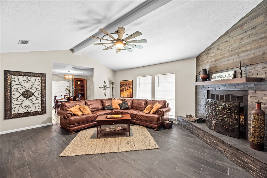 5213 Inverness Drive Corpus Christi, TX 78413 - Photo 4 of 23 a living room with furniture and a fireplace