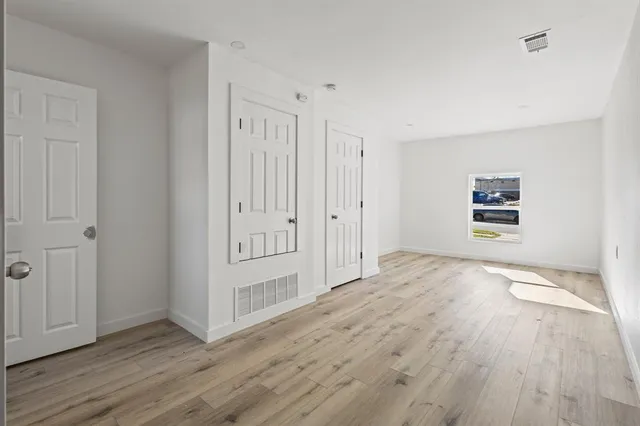a view of a livingroom with wooden floor
