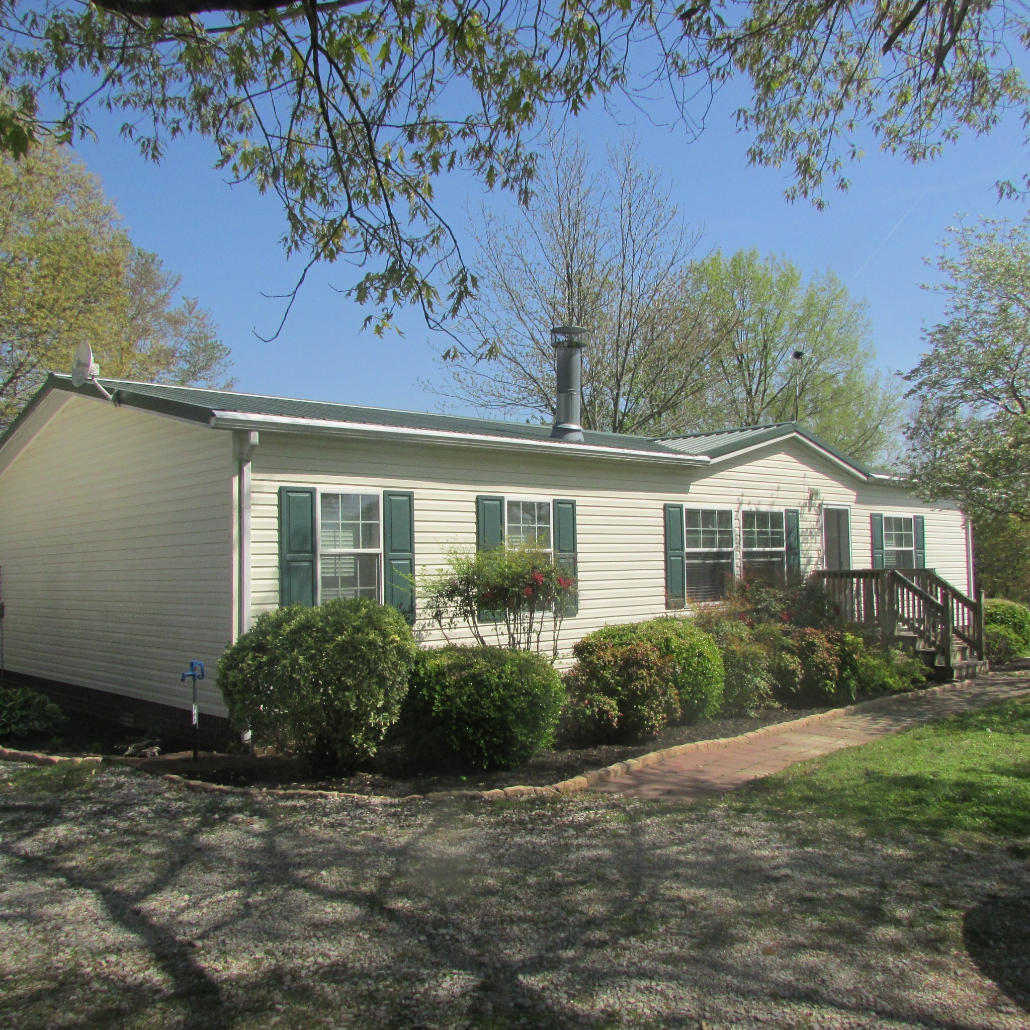 75 Snell Road Ethridge, TN 38456 - Photo 2 of 51 a front view of a house with garden