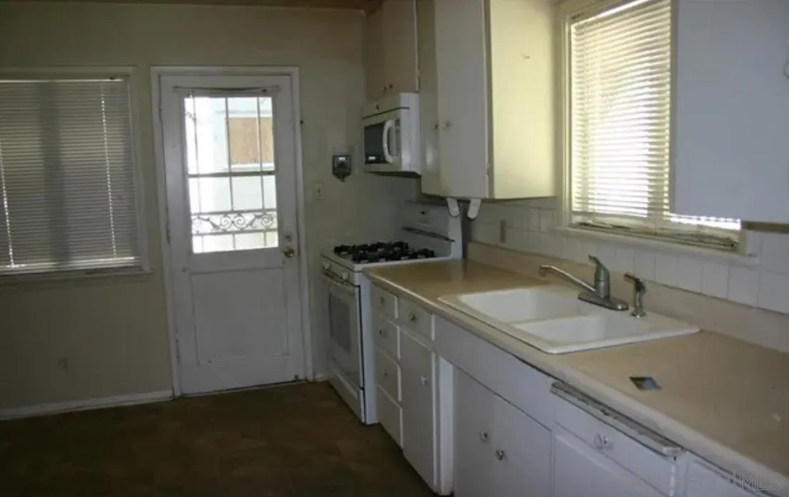7535 Magnolia Avenue Riverside, CA 92504 - Photo 8 of 12 a bathroom with a sink and a window