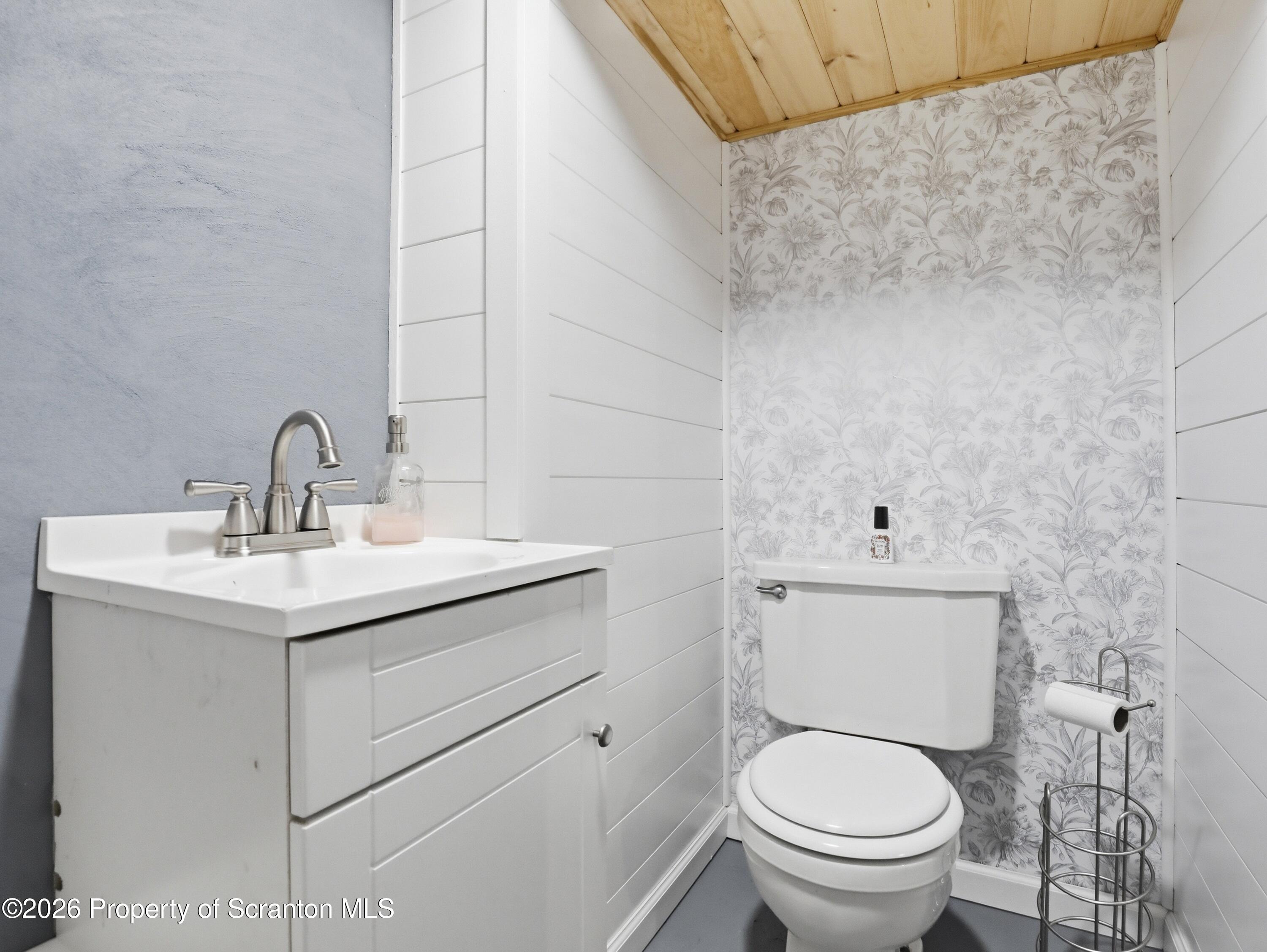 1237 Heart Lake Road Scott Township, PA 18433 - Photo 21 of 39 a bathroom with a toilet sink and mirror