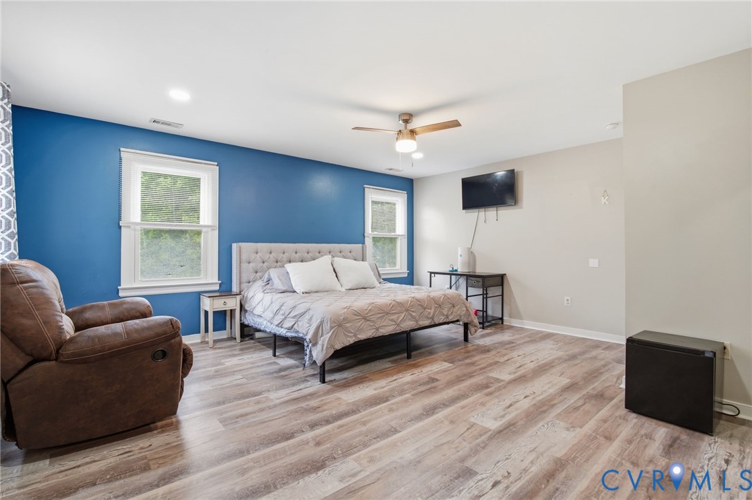 9110 Gayton Road Henrico, VA 23229 - Photo 23 of 54 a bedroom with a bed wooden floor and window