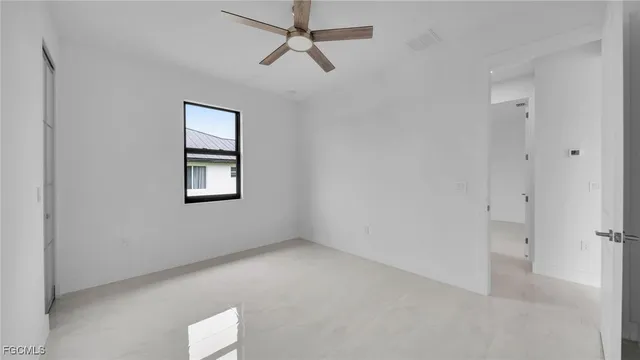 a view of an empty room with a window