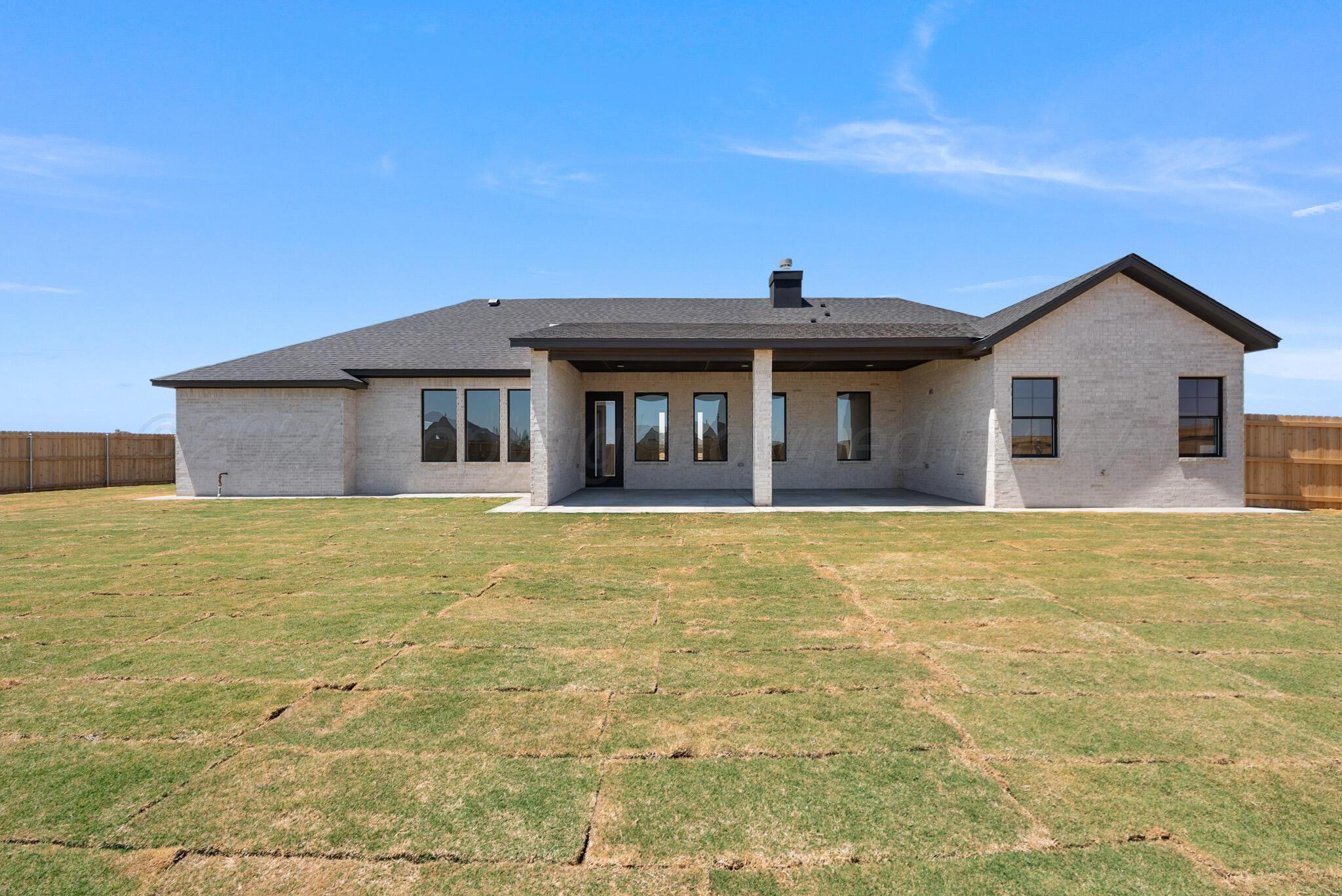 4201 Juniper Springs Road Amarillo, TX 79119 - Photo 27 of 27 a front view of a house with a garden