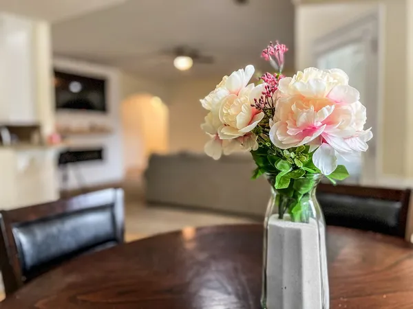 a vase of flowers sitting on a table