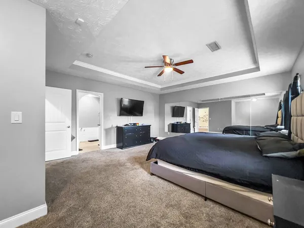 a living room with a couch and a flat screen tv