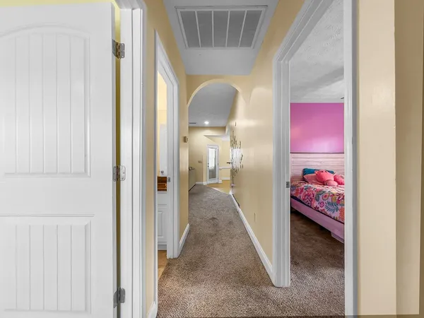 a view of an entryway with a hallway